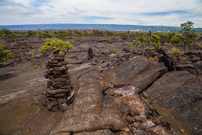 A pile of rocks in a lava field