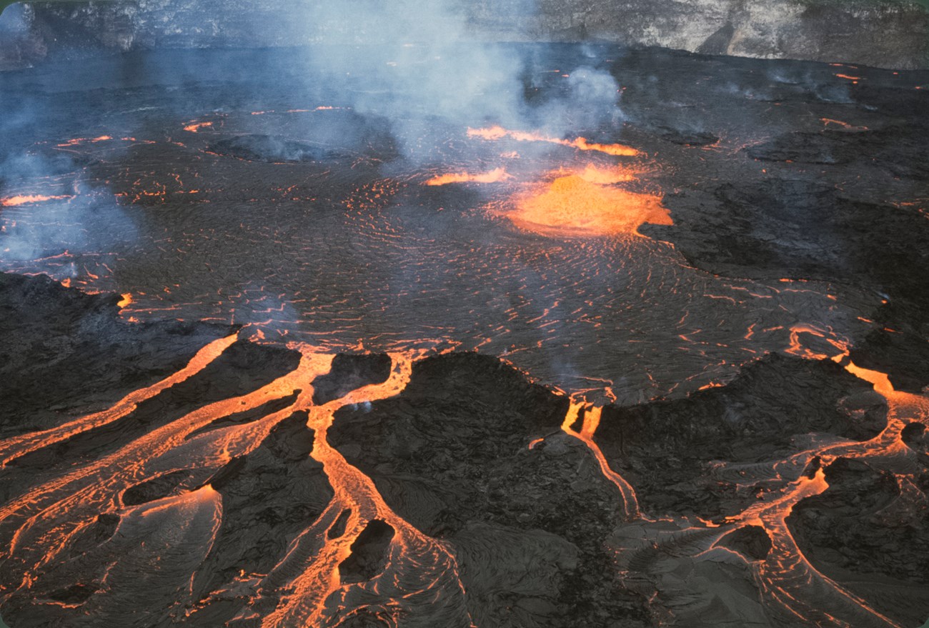 Pond of molten lava in a volcanic crater