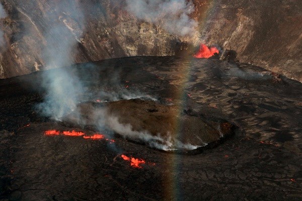 A large rocky mass floating in the center of a lava lake.