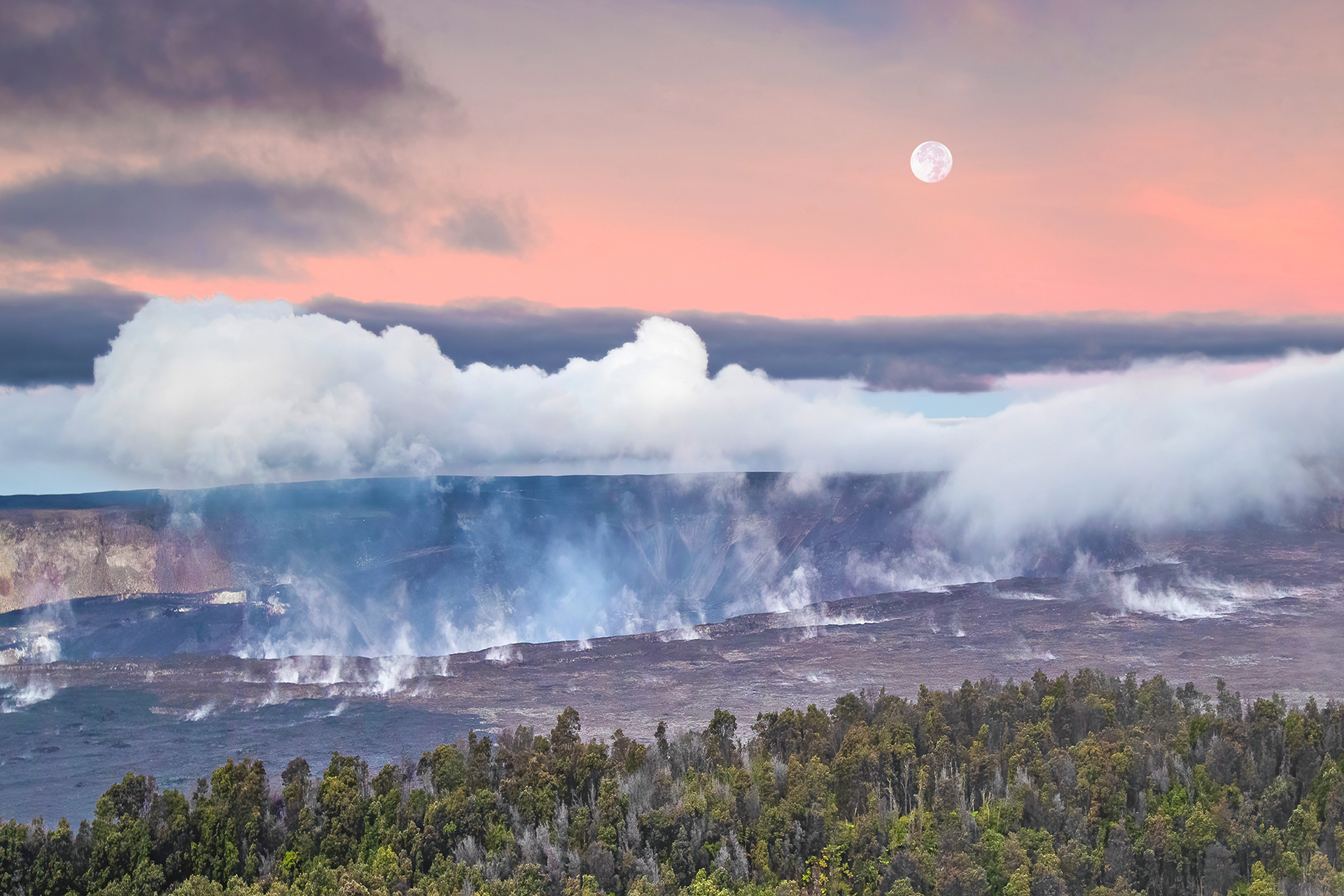 Full moon above a steaming volcanic crater