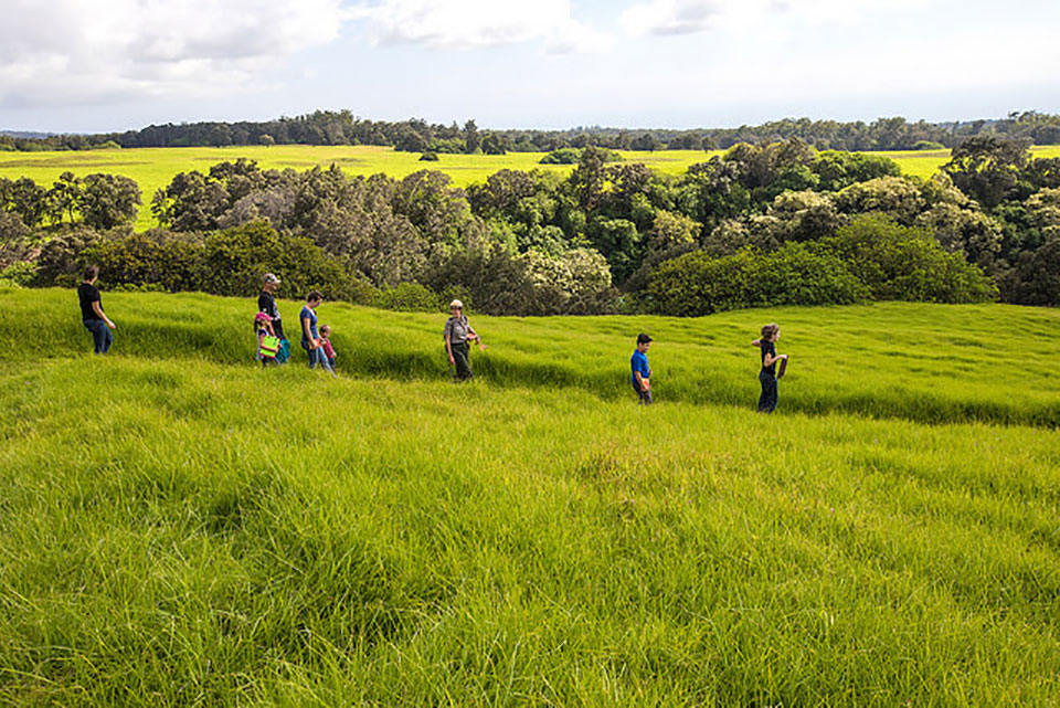 Ranger leading a group down Pu‘u O Lokuana Ranger leading a group down Pu‘u O Lokuana