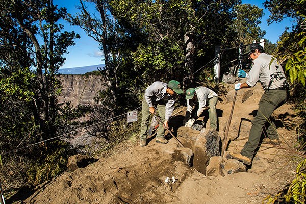 Members of Hawaii Volcanoes National Park's trail crew repair an earthquake-damaged section of Crater Rim Trail Members of Hawaii Volcanoes National Park's trail crew repair an earthquake-damaged section of Crater Rim Trail