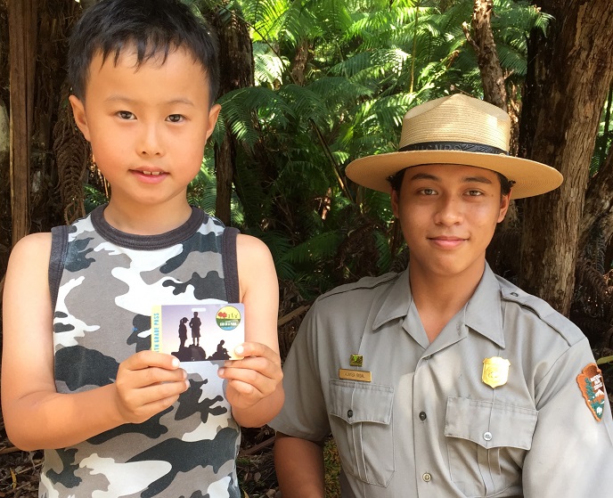 Visitor Ethan displays the Every Kid in a Park pass for 4th graders