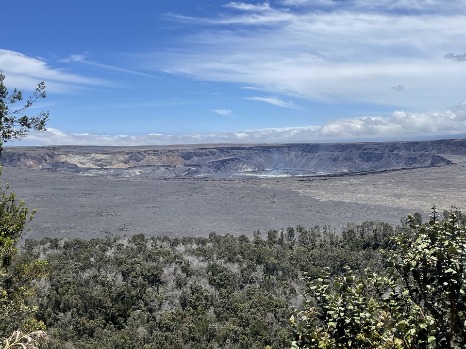 A non-erupting volcanic crater under blue skies