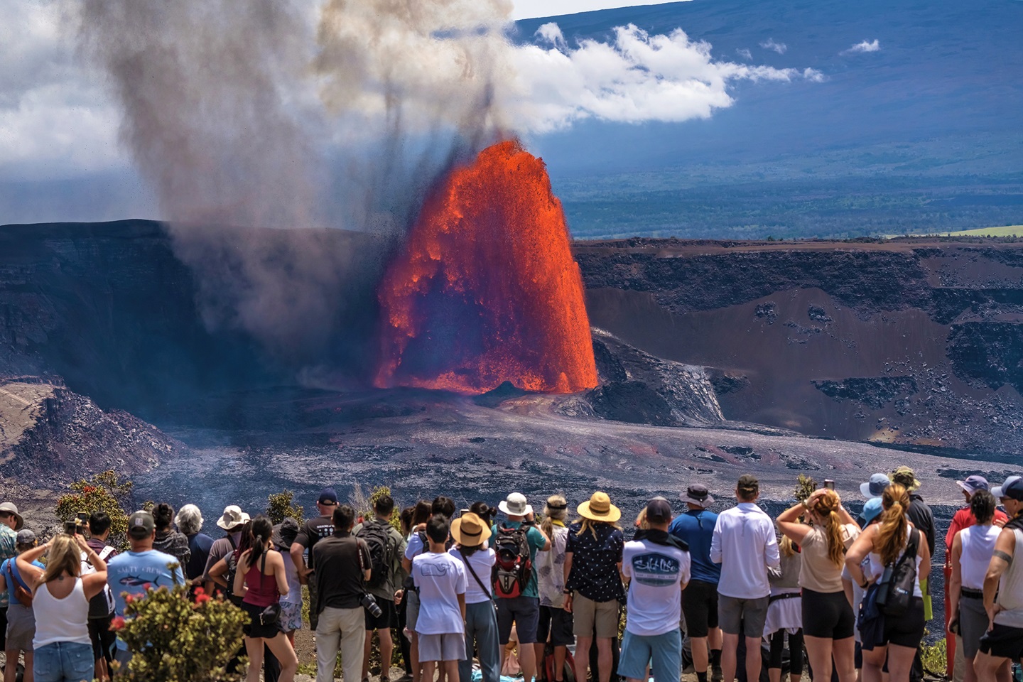960-HAVO_20250611_Visitors watch episode 25 from the Keanakakoi side of the caldera_J.Wei A large group of visitors observe a massive fountain of lava erupt from a volcanic vent