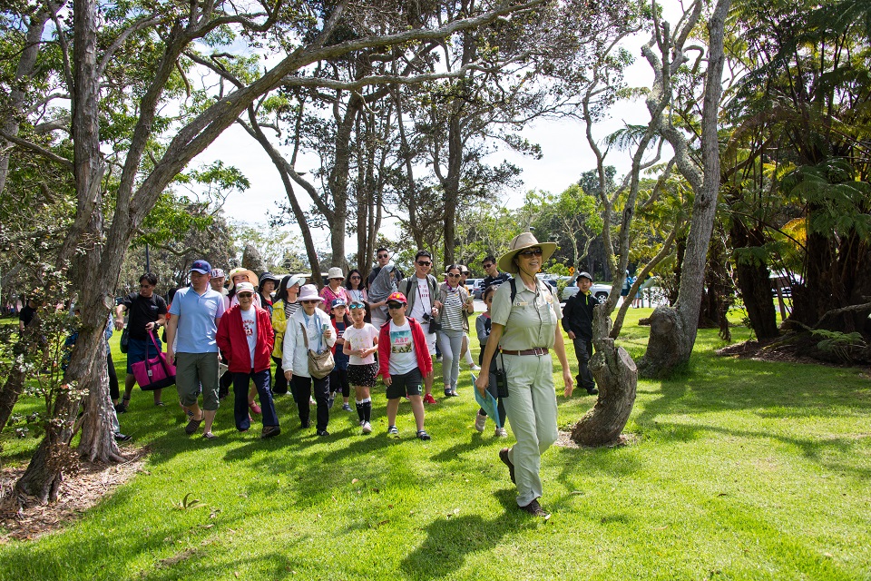 Volunteer leads a group of Chinese hikers