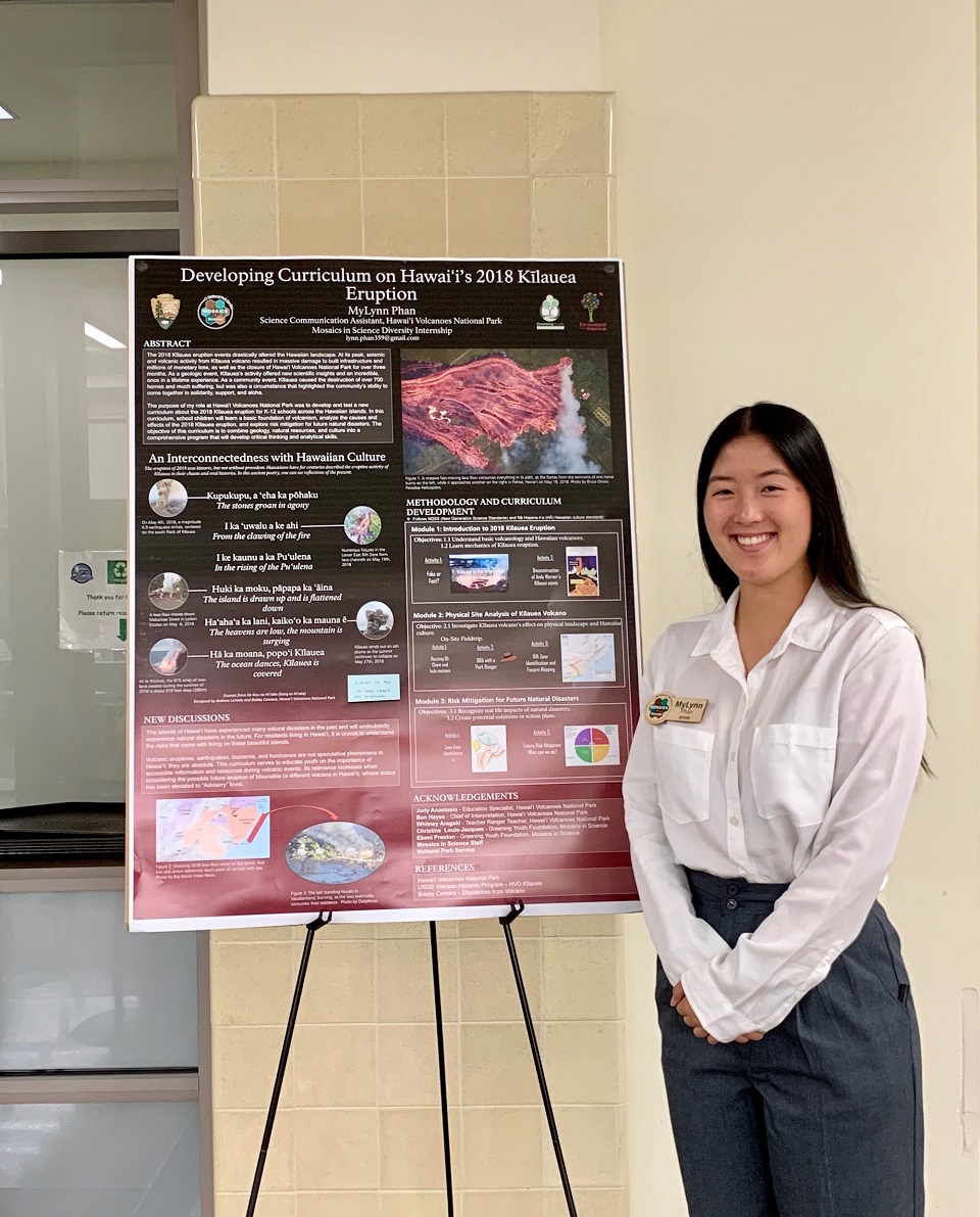 Mosaics in Science 2019 Intern_MyLynn Phan Intern standing by display on easel