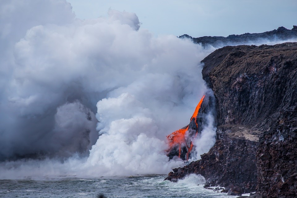 A new lava stream cascades into the ocean