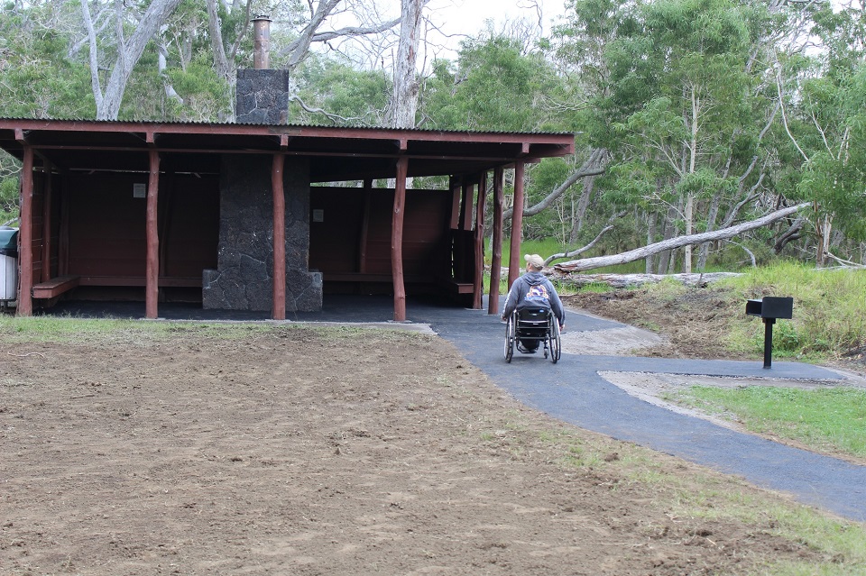 Man in wheelchair at picnic area Man in wheelchair at picnic area