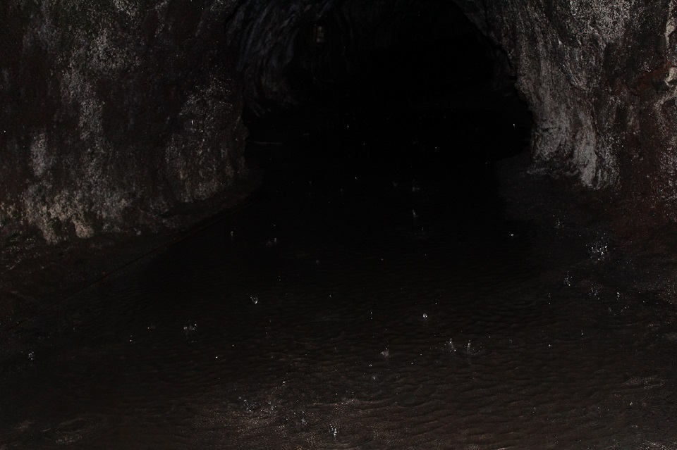 Dark and flooded Nāhuku The flooded and dark lava tube