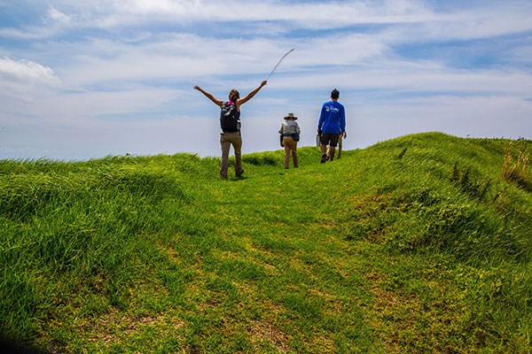 Visitors enjoy a guided hike to Pu‘ū o Lokuana cindercone