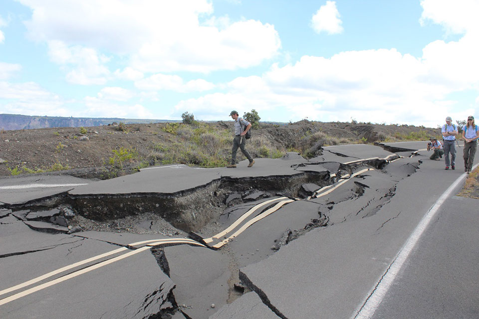 Park staff survey 2018 earthquake damage on the south side of Crater Rim Drive