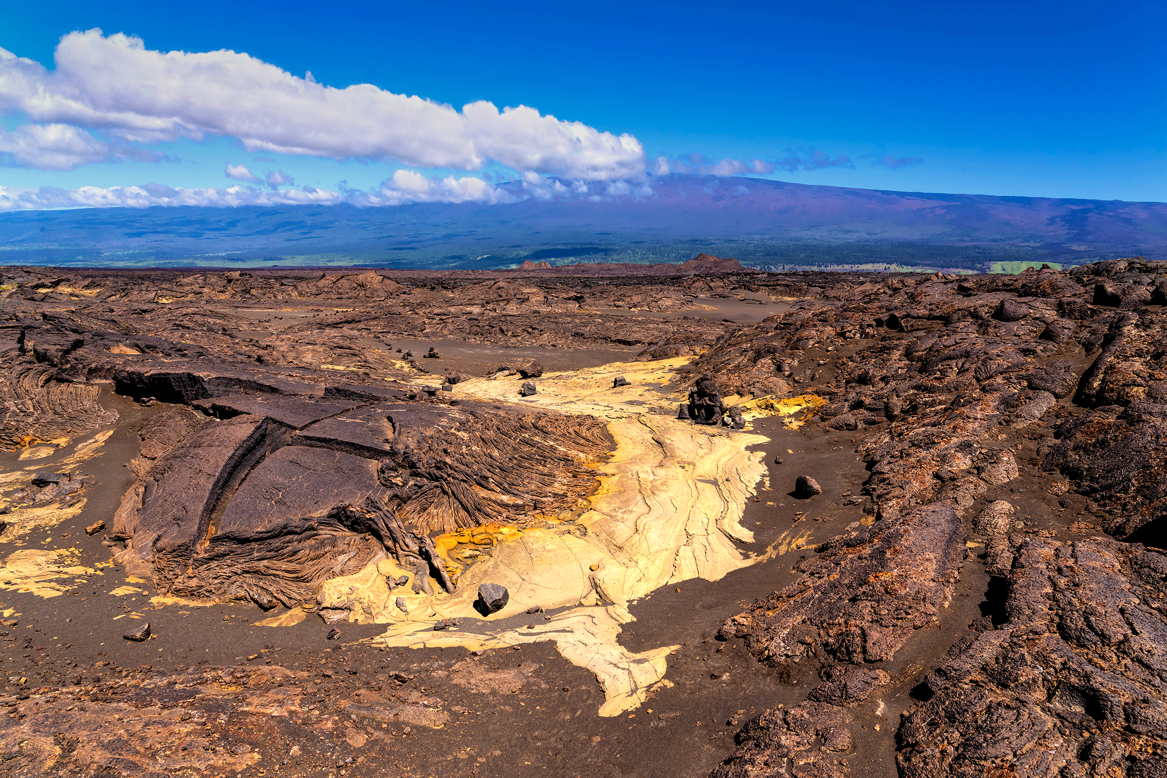 A remote desert trail amidst a lava rock landscape