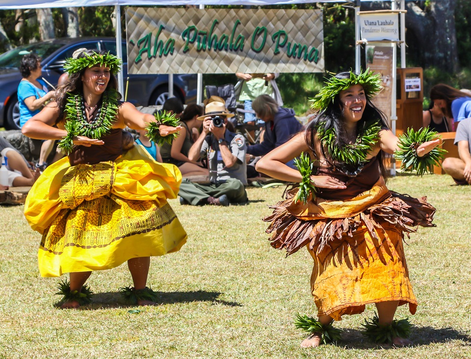 Two hula dancers perform