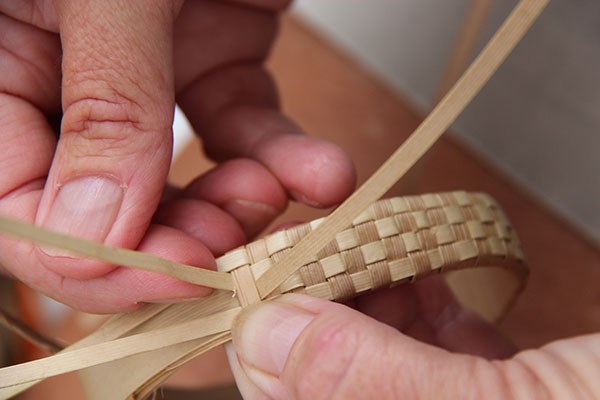 Closeup of a woven lau hala bracelet