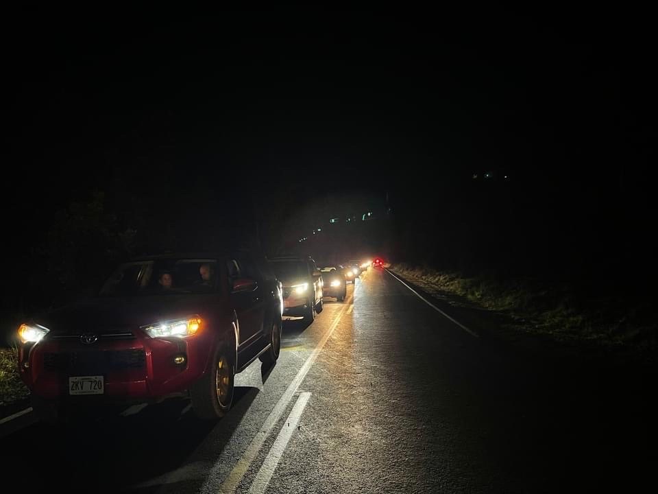 Expect crowds between 6 p.m. to 9 p.m. A line of cars on a road at night.