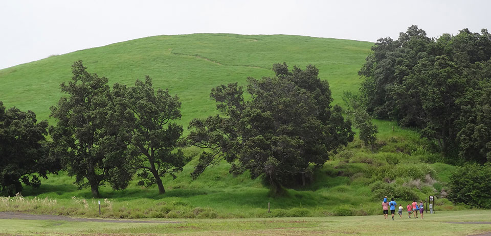 A family gets ready to climb Pu‘u o Lokuana in Kahuku