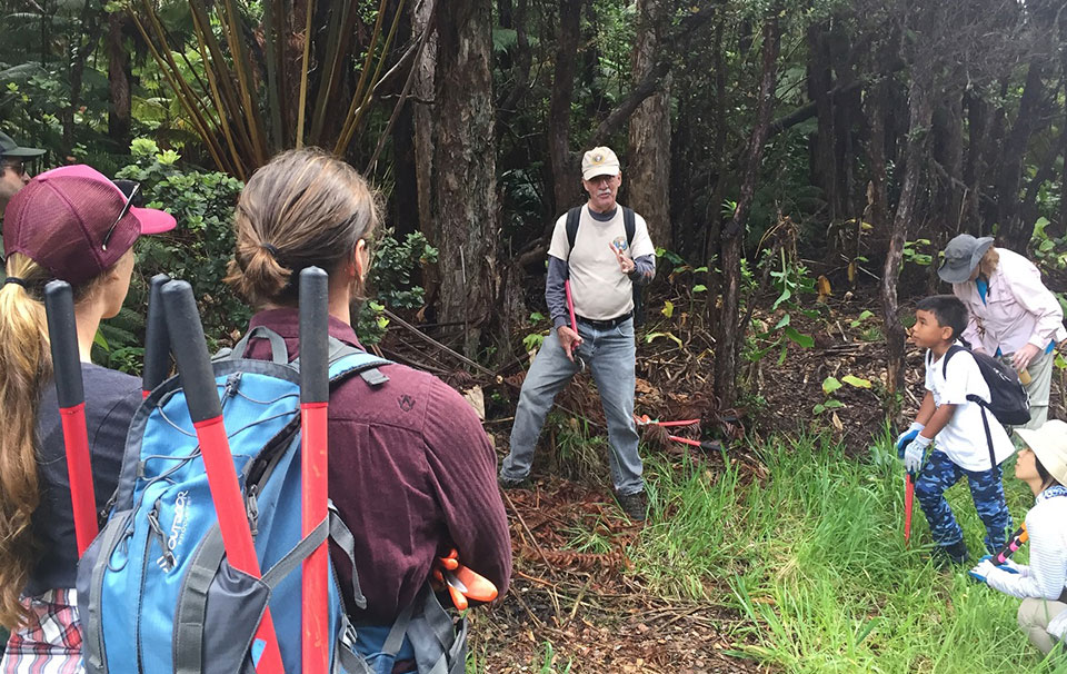 Paul Field instructs volunteers on vegetation management