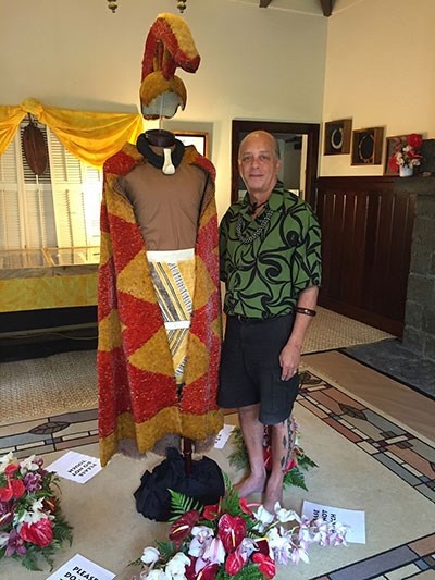 Master feather artist Rick San Nicolas with his feathered cape and cloak