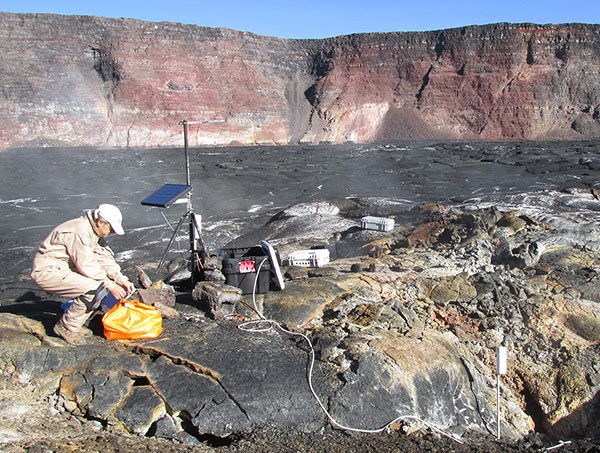 Hawaiian Volcano Observatory scientist monitoring gas emissions on Mauna Loa in 2015