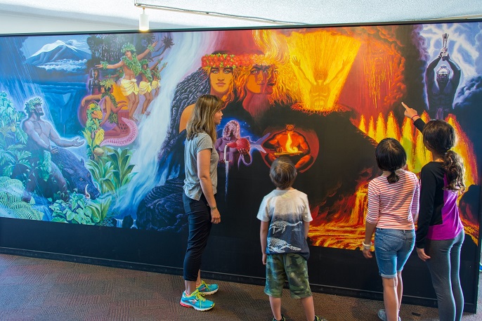 Visitors admiring restored Herb Kane mural