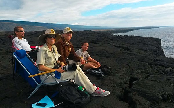 Volunteers at Ka‘ena Point count humpback whales