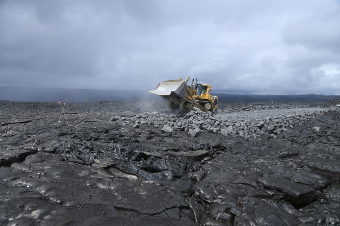 Bulldozer approaches park boundary from Kalapana