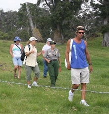 Park Ranger Ruth Levin leads visitors on a hike through Kahuku