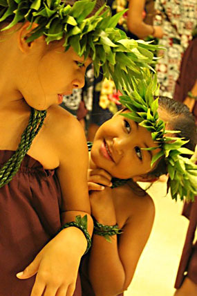 Keiki Haliko and Hi`ilei Hauanio wearing lei