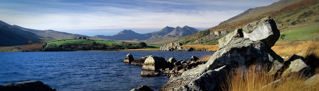 National park in Wales with a large lake and mountains in the distance.