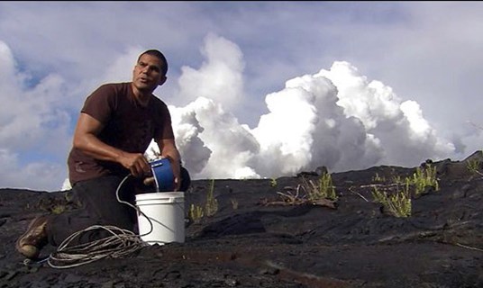 Milton Garces deploying an infrasonic microphone at Kīlauea, 2006