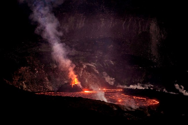 A volcanic crater spewing red lava