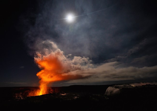 Volcanic gasses illuminated from an erupting crater.