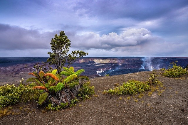 A steaming caldera in a distance.