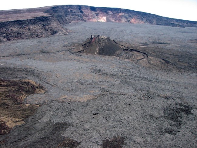 An aerial view of the prominent 1940 cinder-and-spatter cone on the floor of Mauna Loa's summit caldera.