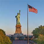 Photo of Statue of Liberty and American flag
