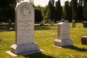 Two white headstones mark the graves of Jesse and Hulda Hoover. Two white headstones mark the graves of Jesse and Hulda Hoover.