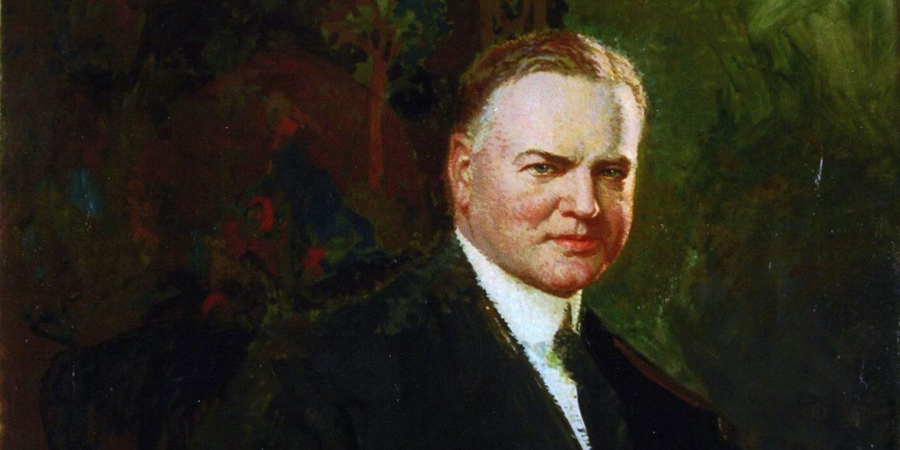 A portrait painting shows a middle aged man in a suit sitting in a dark room.
