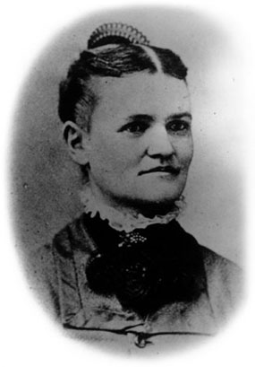 Oval-cropped portrait photograph of a young woman with parted hair and a high-collar dress. Oval-cropped portrait photograph of a young woman with parted hair and a high-collar dress.