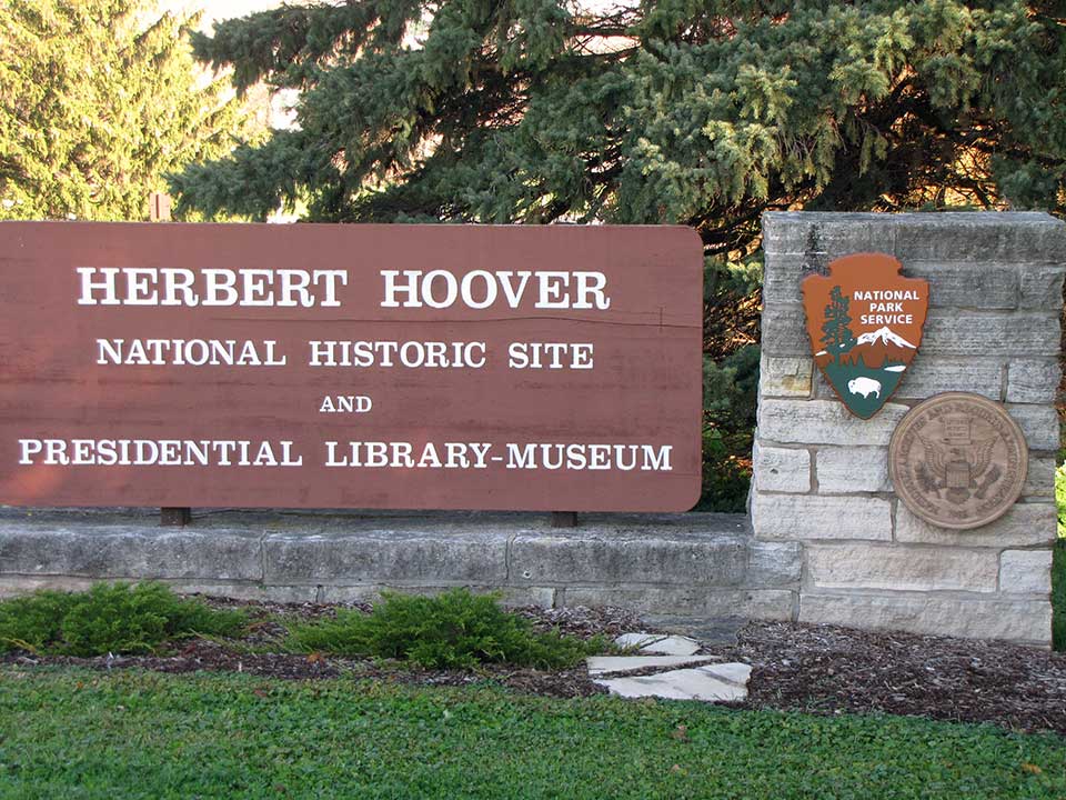 Herbert Hoover NHS Entrance Sign A stone and wood sign marks the entrance to Herbert Hoover park and museum.