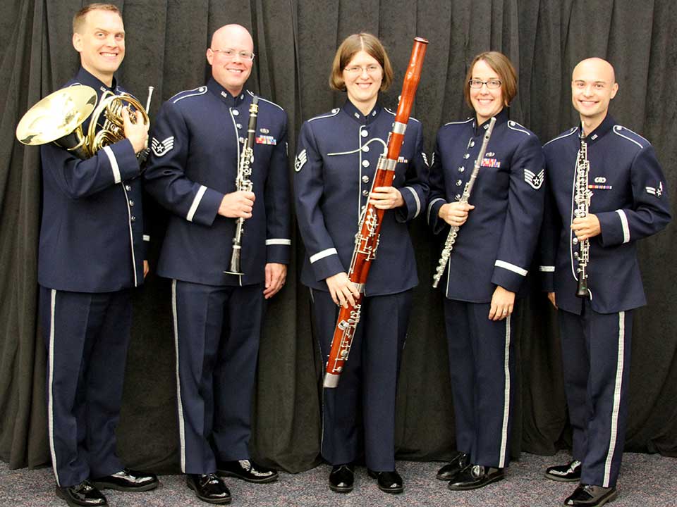 US Air Force Midwest Winds Band A woodwind quintet in Air Force uniforms pose with their instruments.