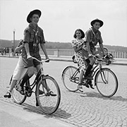 Scouts ride bicycles across AMB in 1937