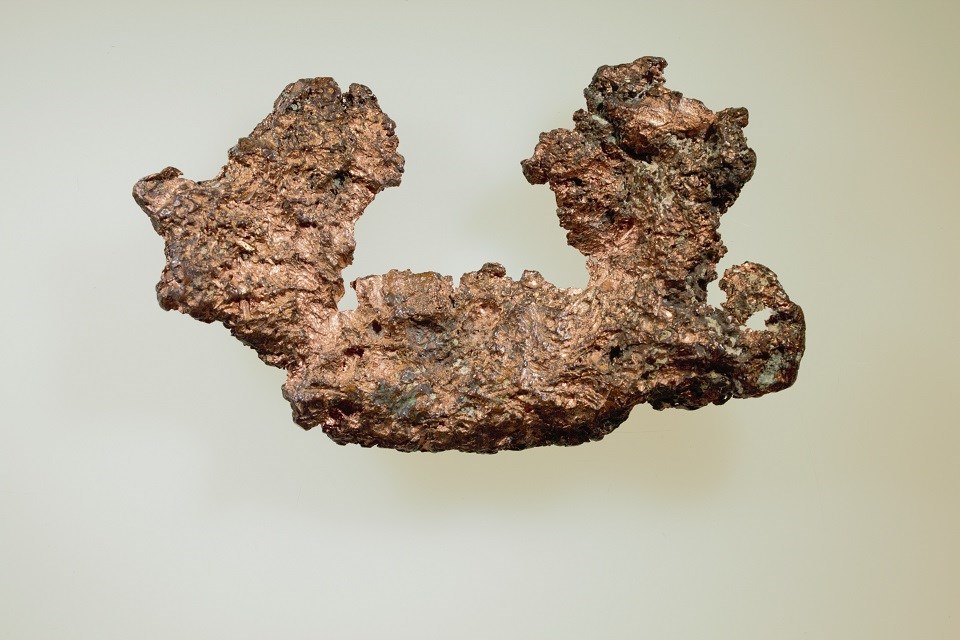 Copper from Lake Superior! shiny, brown-colored metal chunk with pitted surface.