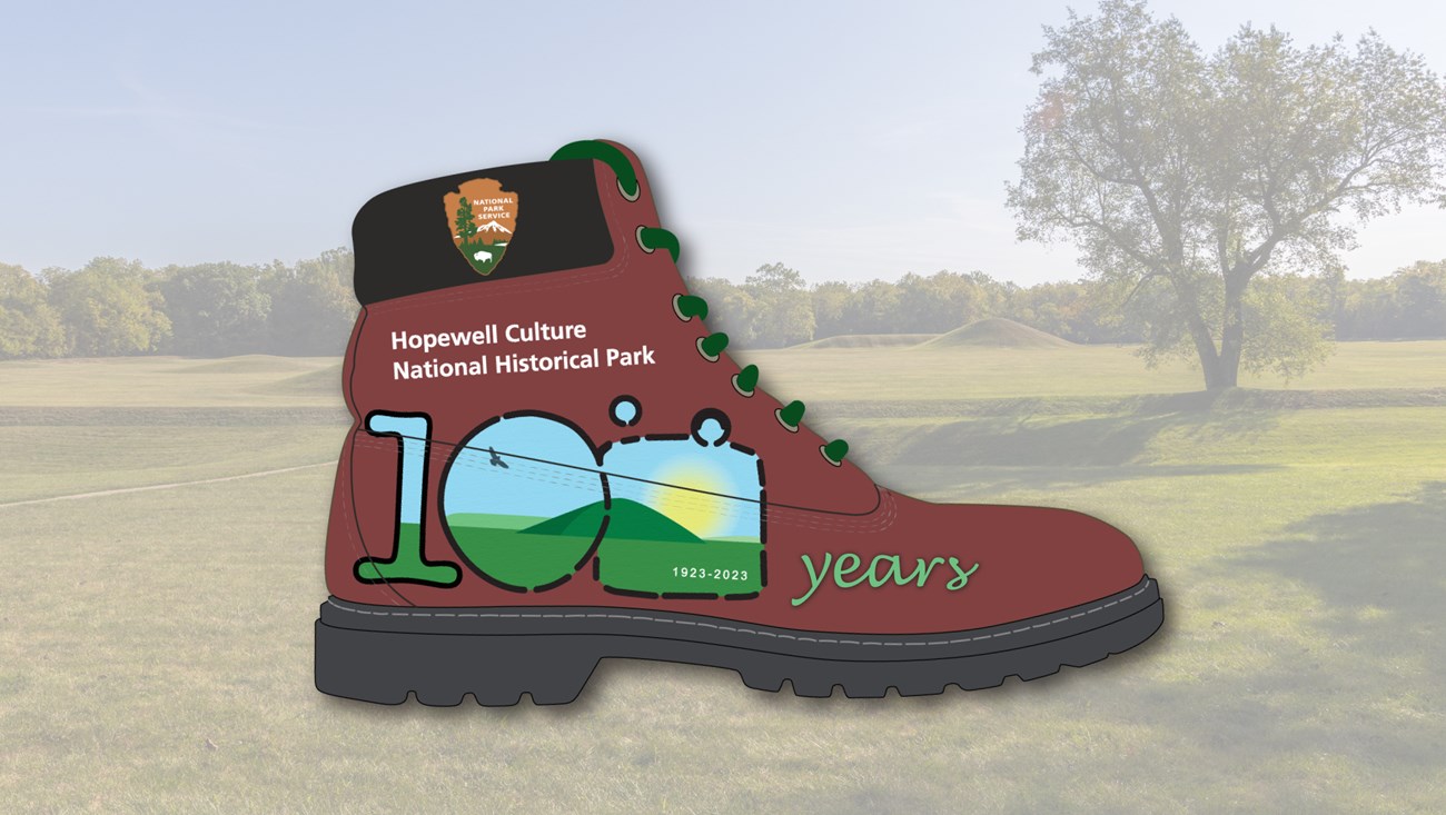 A hiking boot with the park's centennial logo on the side of it with text reading "years" to the right of the 100 logo