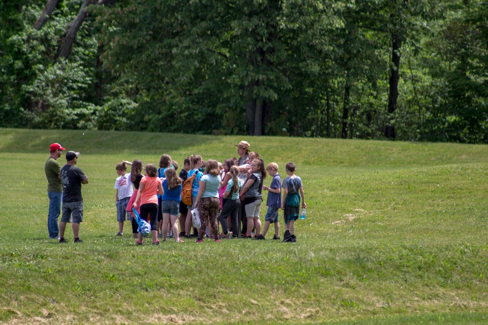 Ranger Tour A ranger speaking to a group of visitors outdoors on a tour