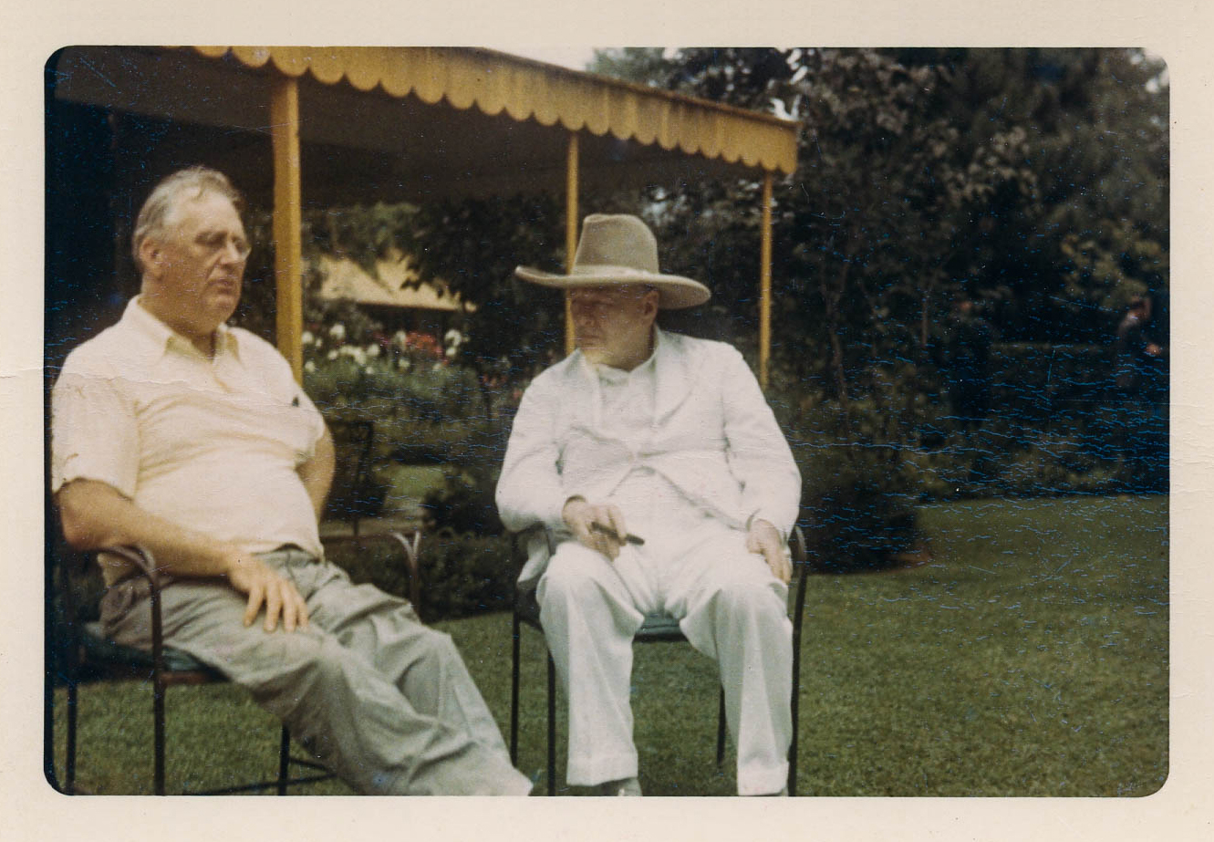 FDR and Winston Churchill seated on the lawn at Val-Kill.