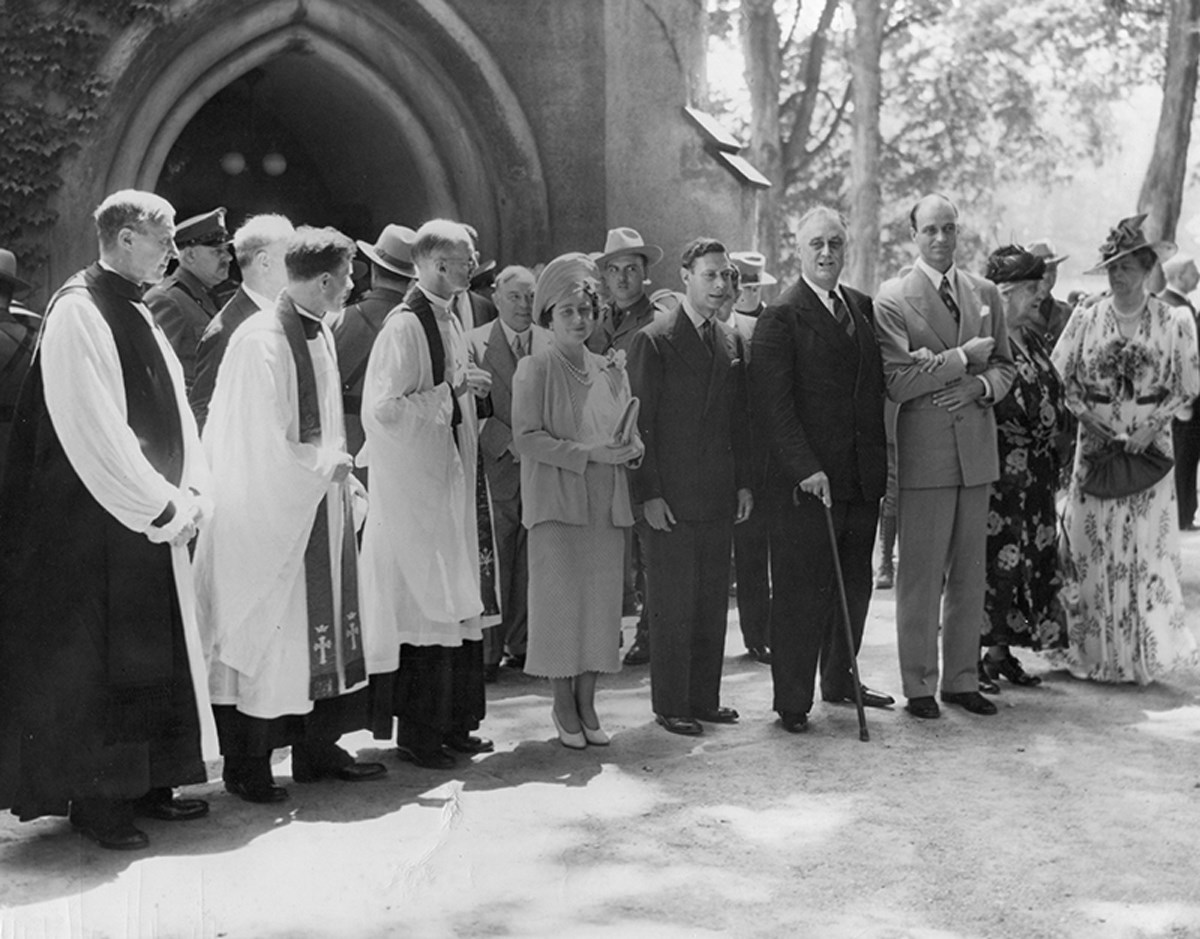 The Roosevelts and the Royal couple standing with friends and family in front of St. James Church in Hyde Park.