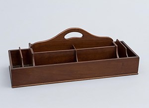 A wooden box with many compartments and a handle at top.
