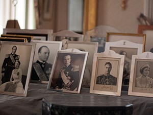 A group of silver framed portraits of royal persons.