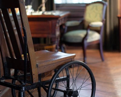 FDR's wheelchair in the family library and living room.